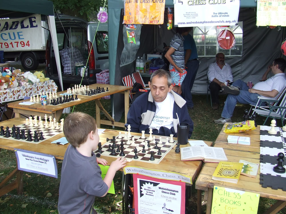 Paul Walters plays an eager talented youngster: Wolverhampton Chess Club stall